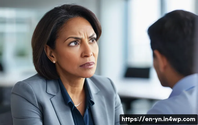 상대방의 감정을 통찰하는 방법 - A close-up portrait of a diverse middle-aged professional woman during a conversation, showing a bri...